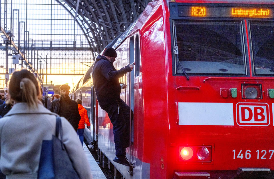 A train driver leaves a train in the central train station in Frankfurt, Germany, Monday, March 11, 2024. German train drivers union GDL called for another strike starting early Tuesday. (AP Photo/Michael Probst)