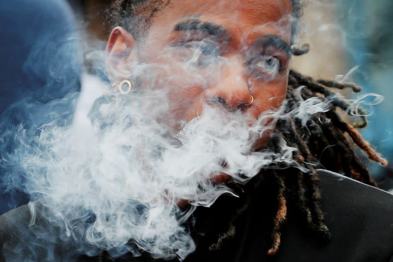 FILE PHOTO: A demonstrator vapes during a protest in Boston