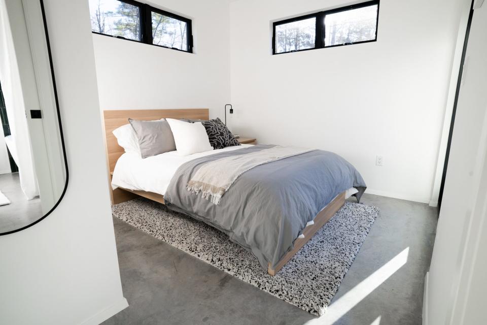 Bedroom with gray bed 