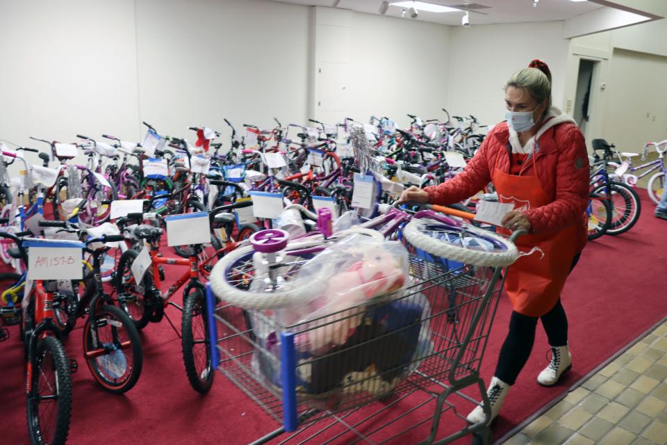 Makayla Howell volunteers as a runner to get gifts for curbside delivery during the 2020 Salvation Army Angel Tree Distribution at Sunset Center.