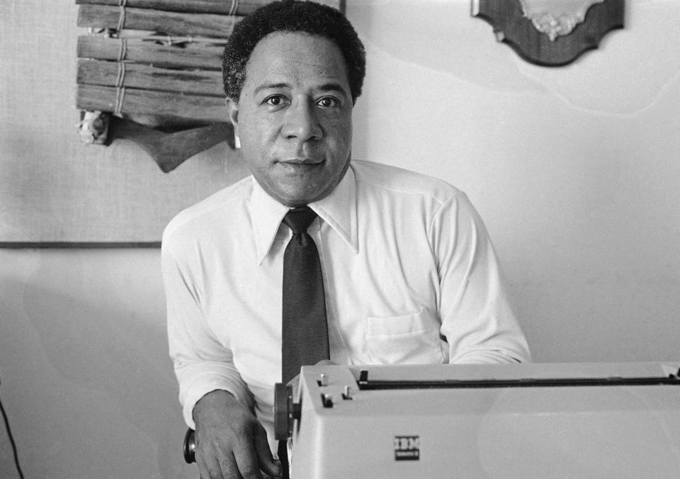 FILE - Writer Alex Haley, who traced his family back to Africa poses in his San Fransisco apartment May 16, 1974. The miniseries "Roots" debuts on ABC based on a book by Haley and runs through Jan. 30 attracting record ratings, with the finale drawing a 71% share of the TV audience. (AP Photo, File)