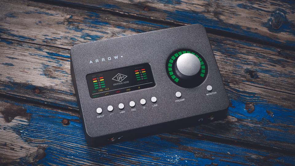 A Universal Audio audio interface on a wooden floor