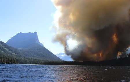 The Reynolds Creek Wildland Fire burns in Glacier National Park, Montana in this photo taken July 21, 2015. REUTERS/Erin Conwell