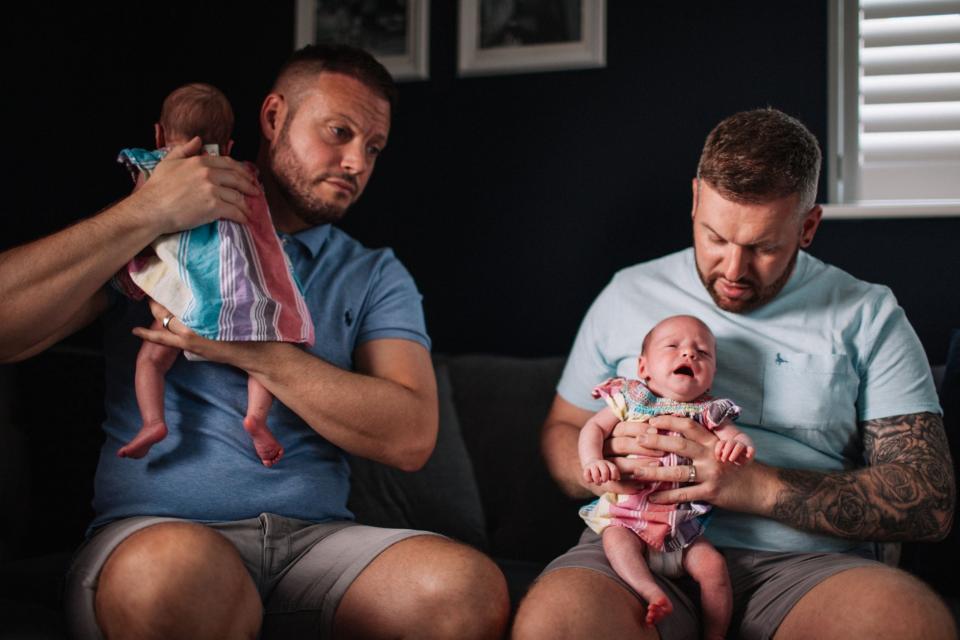 Paul and Craig holding babies on sofa (BBC / The Garden Productions / Harry Winteringham)