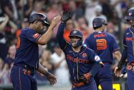 Houston Astros' Jose Altuve, right, celebrates with Jose Abreu (79) after hitting a grand slam against the Minnesota Twins during the seventh inning of a baseball game Monday, May 29, 2023, in Houston. (AP Photo/David J. Phillip)