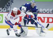 Montreal Canadiens left wing Artturi Lehkonen (62) tries to get past Vancouver Canucks goaltender Thatcher Demko (35) during the first period of an NHL hockey game Thursday, Jan. 21, 2021, in Vancouver, British Columbia. (Jonathan Hayward/The Canadian Press via AP)