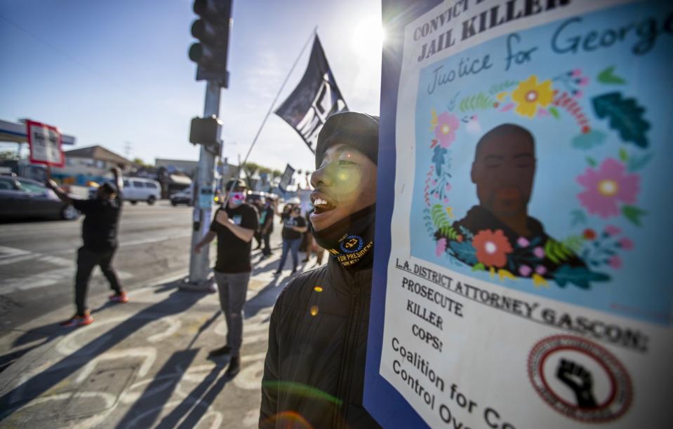 Justin Stephenson, of Los Angeles, celebrates the news of the Chauvin guilty verdicts along with fellow demonstrators.