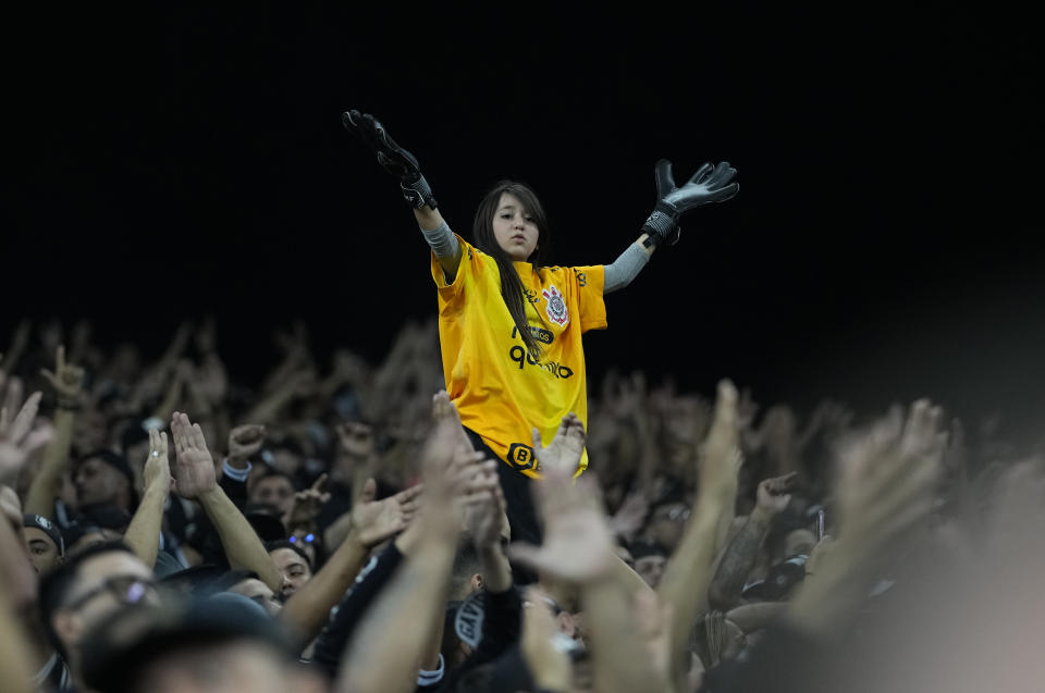 A fan of Brazil's Corinthians cheers prior a Copa Libertadores quarter-final first leg soccer match against Brazil's Flamengo at Neo Quimica Arena stadium in Sao Paulo, Brazil, Tuesday, Aug. 2, 2022. (AP Photo/Andre Penner)