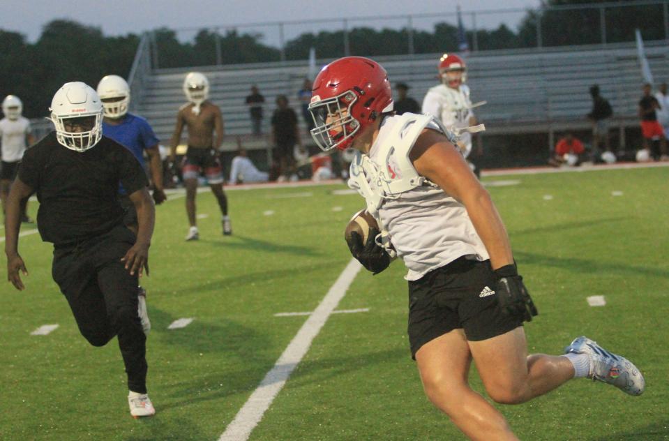 Johnstown's McKaden Thomas turns upfield after catching a pass in the flat during a passing scrimmage against visiting Linden-McKinley at Frank H. Chambers Stadium on Tuesday, July 11, 2023.