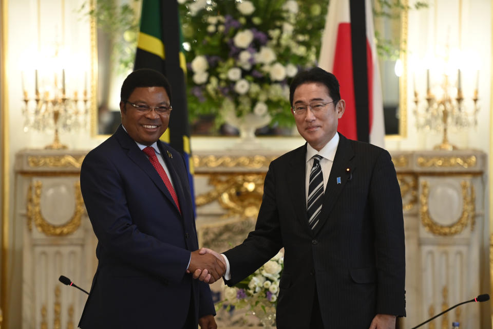 United Republic of Tanzania Prime Minister Kassim Majaliwa, left, and Japan's Prime Minister Fumio Kishida shake hands prior to the Japan-Tanzania summit meeting at the Akasaka Palace State Guest House Monday, Sept. 26, 2022, in Tokyo. (David Mareuil/Pool Photo via AP)