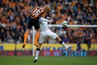 Hull City's Irish defender Paul McShane (L) goes up for a header against Manchester United's Belgian midfielder Marouane Fellaini (R) during the English Premier League football match in Kingston upon Hull, England on May 24, 2015