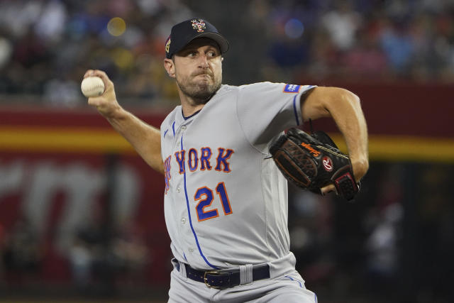 New York Mets starting pitcher Max Scherzer tosses the ball up