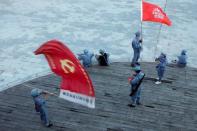 Participants dressed in replica red army uniforms take part in a Communist team-building course extolling the spirit of the Long March in the mountains outside Jinggangshan, Jiangxi province, China, September 14, 2017. REUTERS/Thomas Peter