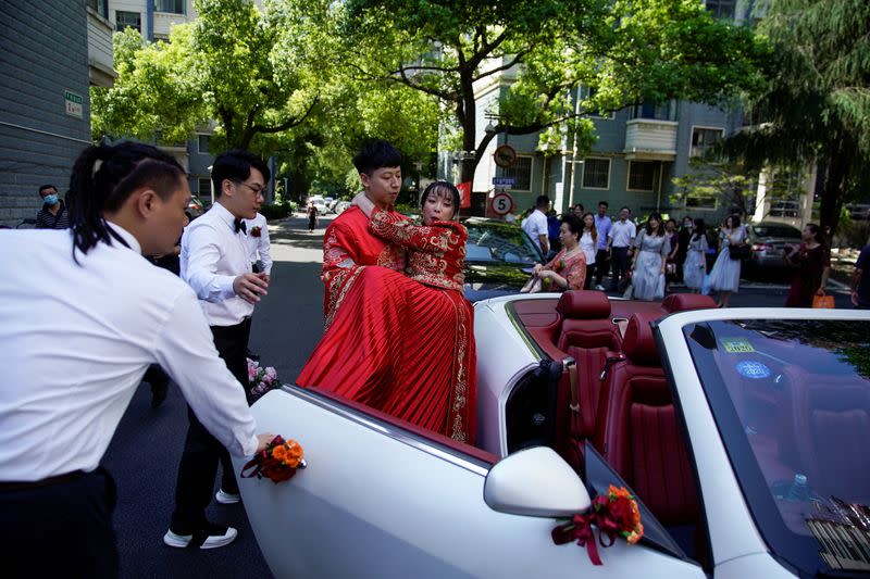 The Wider Image: Coronavirus dampens celebrations in China's wedding gown city