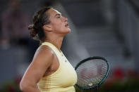 Aryna Sabalenka, of Belarus, reacts during a match against Mirra Andreeva, of Russia, during the Mutua Madrid Open tennis tournament in Madrid, Wednesday, May 1, 2024. (AP Photo/Manu Fernandez)