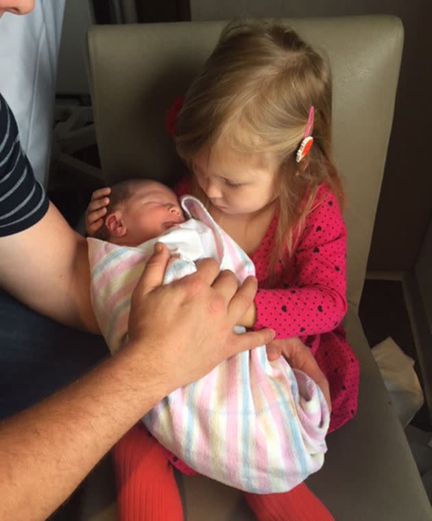 Young Frankie holds her new baby brother. Image: Supplied