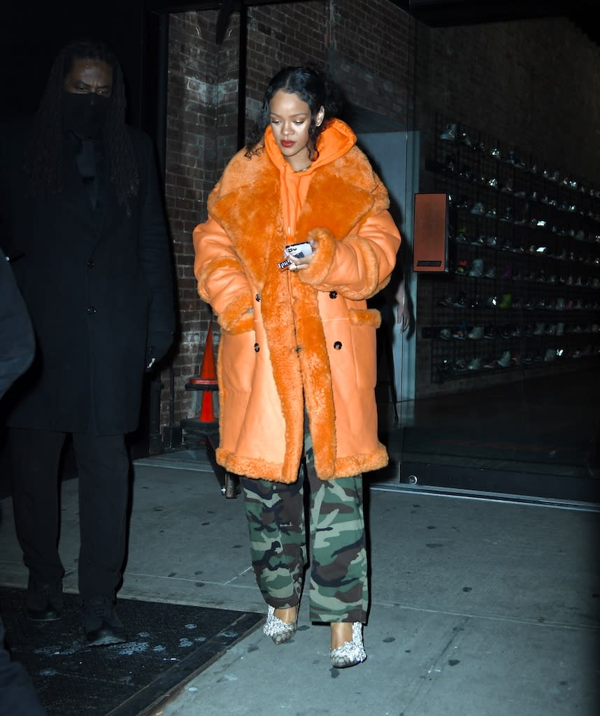 Rihanna out and about in NYC in an orange coat and Gucci x Balenciaga Knife heels on Jan. 26, 2022. - Credit: WavyPeter / SplashNews.com