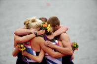 The Great Britain Mixed Coxed Four Rowing - LTAMix4 team hug each other during the medal ceremony after winning gold on day 4 of the London 2012 Paralympic Games at Eton Dorney on September 2, 2012 in Windsor, England. (Photo by Matthew Lloyd/Getty Images)