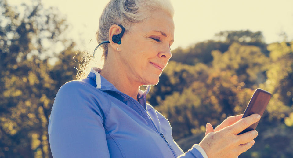 Woman exercising outside, representing someone with breast cancer. (Getty Images)