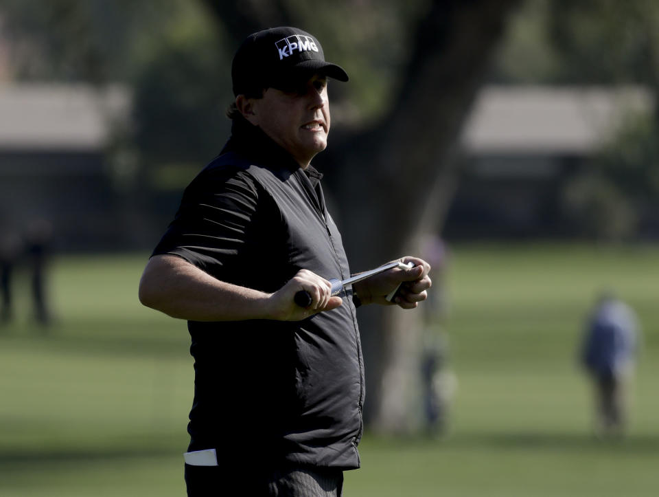 Phil Mickelson reacts after missing a birdie putt on the 12th hole during the first round of the CareerBuilder Challenge at the La Quinta County Club Thursday, Jan. 19, 2017 in La Quinta, Calif. (AP Photo/Chris Carlson)