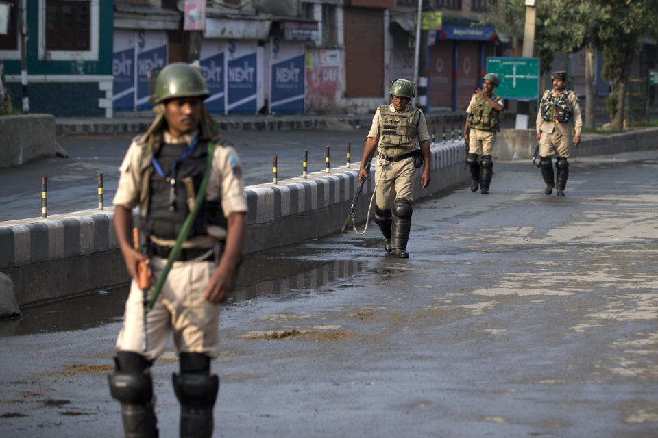 Indian Paramilitary soldiers patrol during curfew in Srinagar, Indian controlled Kashmir, Wednesday, Aug. 7, 2019. Authorities in Hindu-majority India clamped a complete shutdown on Kashmir as they scrapped the Muslim-majority state's special status, including exclusive hereditary rights and a separate constitution, and divided it into two territories. (AP Photo/Dar Yasin)