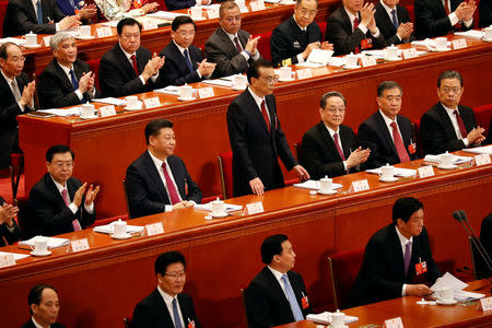 Chinese Premier Li Keqiang takes his seat after delivering the speech during the opening session of the National People's Congress (NPC) at the Great Hall of the People in Beijing, China March 5, 2018. REUTERS/Damir Sagolj