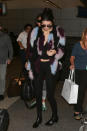 <p>One has to hope that Kendall Jenner really likes airports, because she sure seems to spend a lot of her time in them! On Tuesday, the model returned to Los Angeles just in time to watch the Victoria’s Secret Fashion Show when it aired on CBS. She looked cozy and flight-appropriate in black leggings, a cropped henley, nearly-flat booties, and the outfit’s pièce de résistance—a shaggy, technicolor coat. Wonder how many Muppets were harmed in the making of it?</p><p><i>(Photo: Getty)</i><br></p>