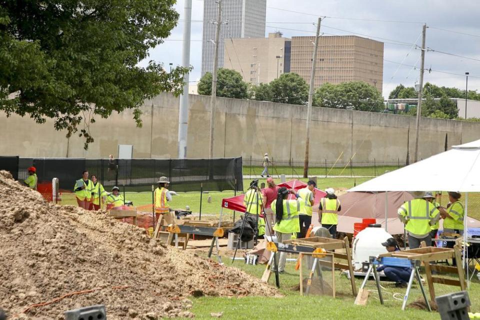 Workers excavating remains of possible Tulsa Race Massacre victims at Oaklawn Cemetery on Tuesday (local time). Source: AP