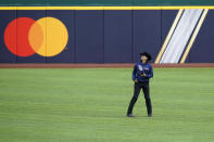 Tampa Bay Rays pitcher Brent Honeywell Jr. wears boots and a cowboy hat as he walks across the outfield at Globe Life Field as the team prepares for the baseball World Series against the Los Angeles Dodgers, in Arlington, Texas, Wednesday, Oct. 14, 2020. (AP Photo/Eric Gay)