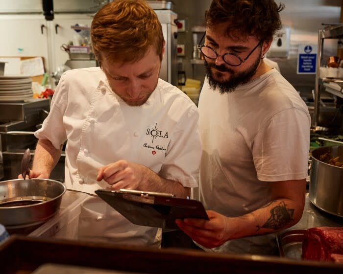 (L-R) Sous chef Andy Parker and head chef Salvo Greco food prepping at SOLA, 31 May 2022. (Photo/Alice Zoo on assignment for the LA Times)