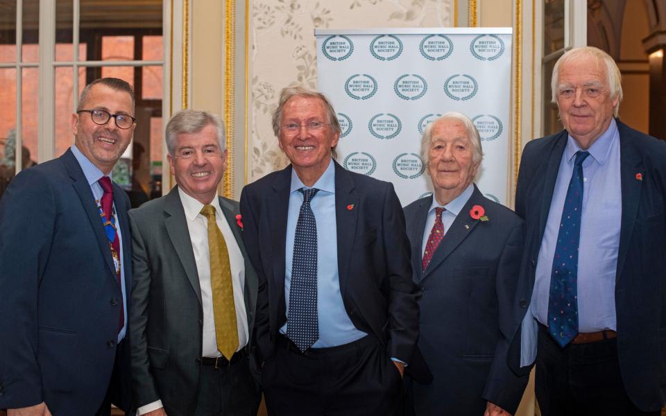 Calvin with Tommy Steele, centre, Tim Rice, right, and others in 2019 - PA/Alamy