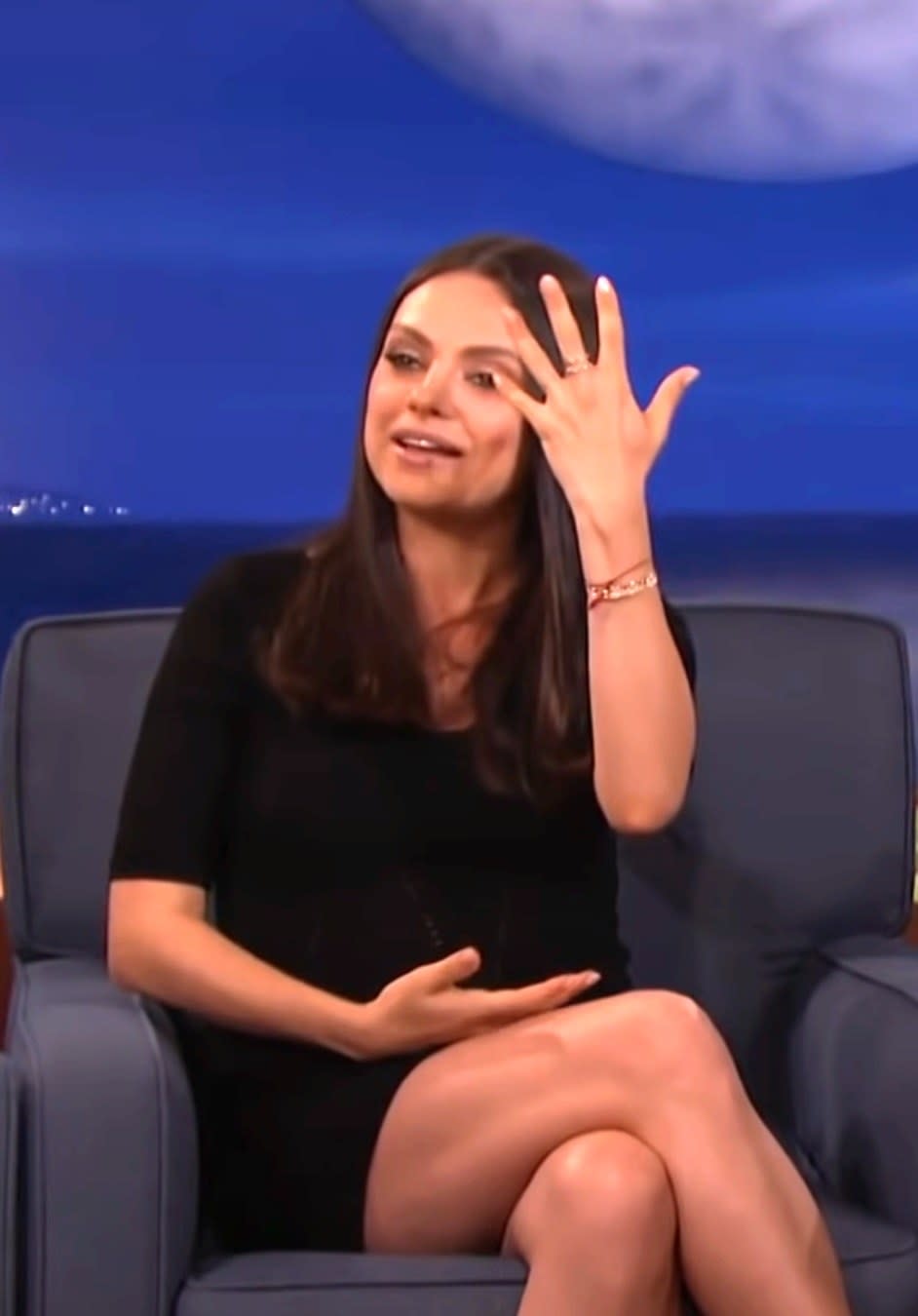 Mila Kunis showing her ring