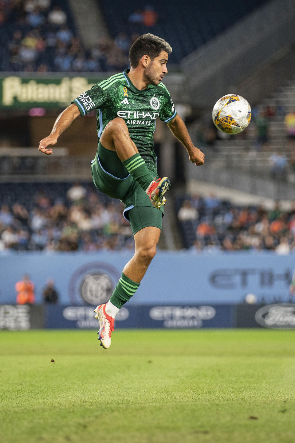 New York City FC midfielder Andres Jasson jumps to control the ball during the first half of the team's MLS soccer match against CF Montreal at Yankee Stadium, Wednesday, Aug. 30, 2023, in New York. (AP Photo/Eduardo Munoz Alvarez)