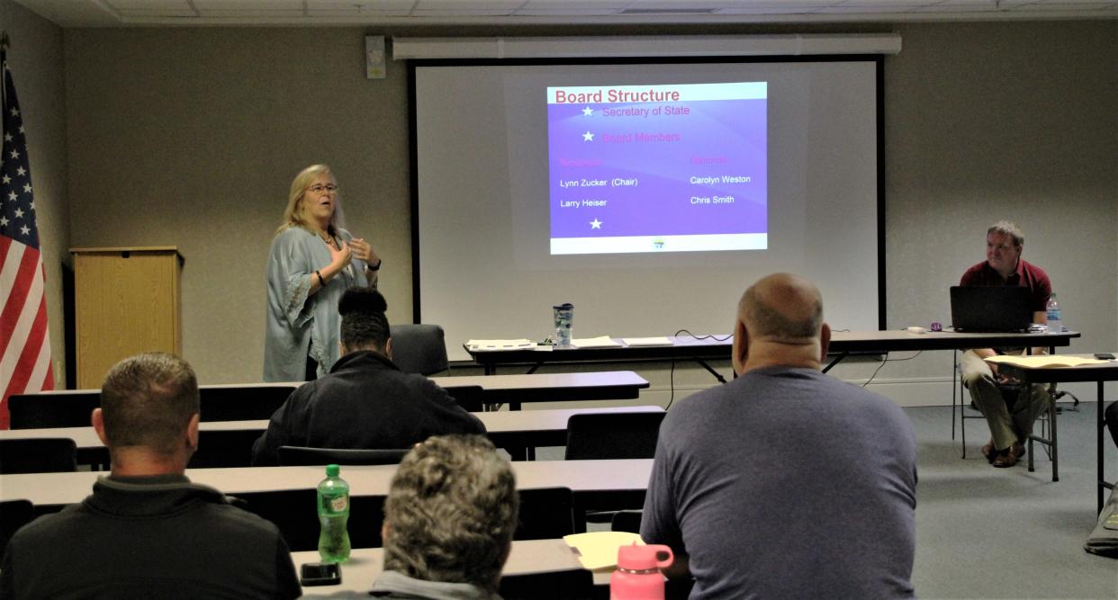 In this Marion Star photo from 2019, Marion County Board of Elections Director Cindy Price, standing left, talks to local residents attending a candidate information session. She and Deputy Director Brian Blair provided information about filing candidate petitions, campaign finance, and other topics.  The Board of Elections offered its most recent session on Jan. 19, 2022, and will offer another session in July 2022.