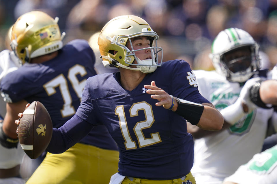 Notre Dame quarterback Tyler Buchner (12) throws against Marshall in South Bend, Ind., Saturday, Sept. 10, 2022. (AP Photo/Michael Conroy)