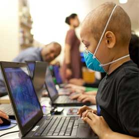 A young cancer patient plays Re-Mission 2: Nanobot's Revenge in a waiting room at Lucile Packard Children's Hospital in Palo Alto, Calif.