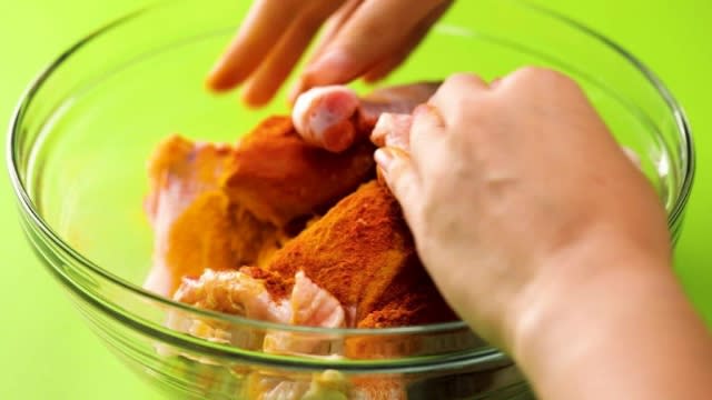 Rubbing spices into chicken