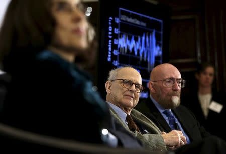 Dr. Rainer Weiss, emeritus professor of physics at MIT, (C) and Dr. Kip Thorne of Caltech (R), listen during a news conference to discuss the detection of gravitational waves, ripples in space and time hypothesized by physicist Albert Einstein a century ago, in Washington February 11, 2016. REUTERS/Gary Cameron/Files