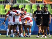 2016 Rio Olympics - Rugby - Preliminary - Men's Pool C New Zealand v Japan - Deodoro Stadium - Rio de Janeiro, Brazil - 09/08/2016. Japan celebrates after defeating New Zealand. REUTERS/Alessandro Bianchi