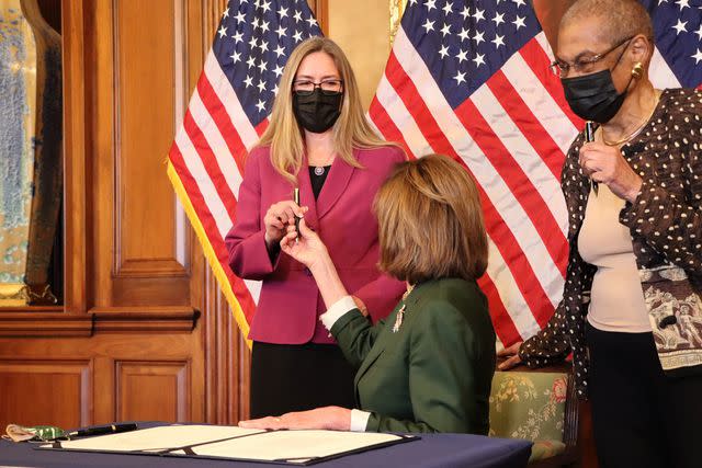 <p>Courtesy of the Wexton Office</p> Speaker Nancy Pelosi and Rep. Jennifer Wexton hold a bill enrollment ceremony after Congress voted to award Capitol police officers the Congressional Medal of Honor for their bravery during the Jan. 6, 2021, riot