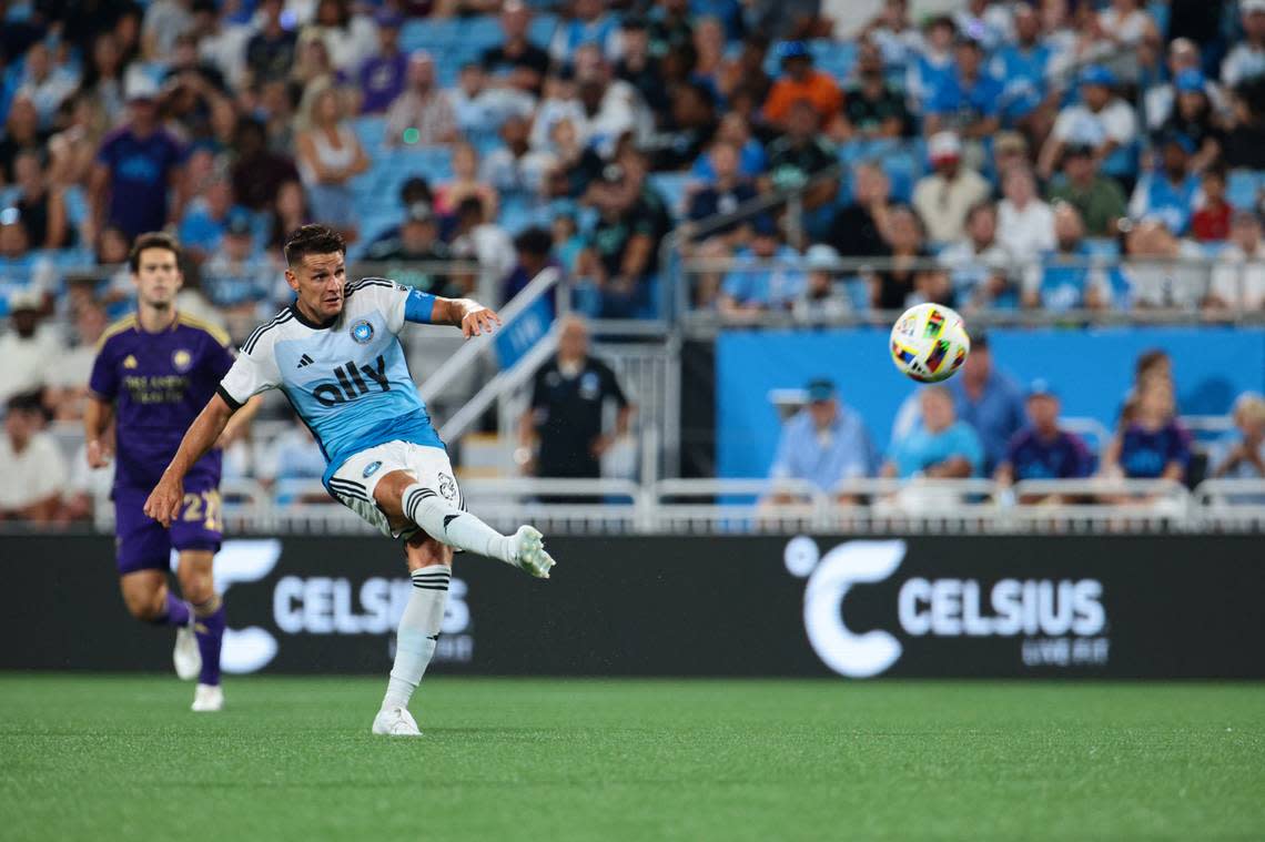 Charlotte FC midfielder Ashley Westwood (8) kicks the ball against Orlando City during Wednesday’s second half at Bank of America Stadium. Scott Kinser-USA TODAY Sports