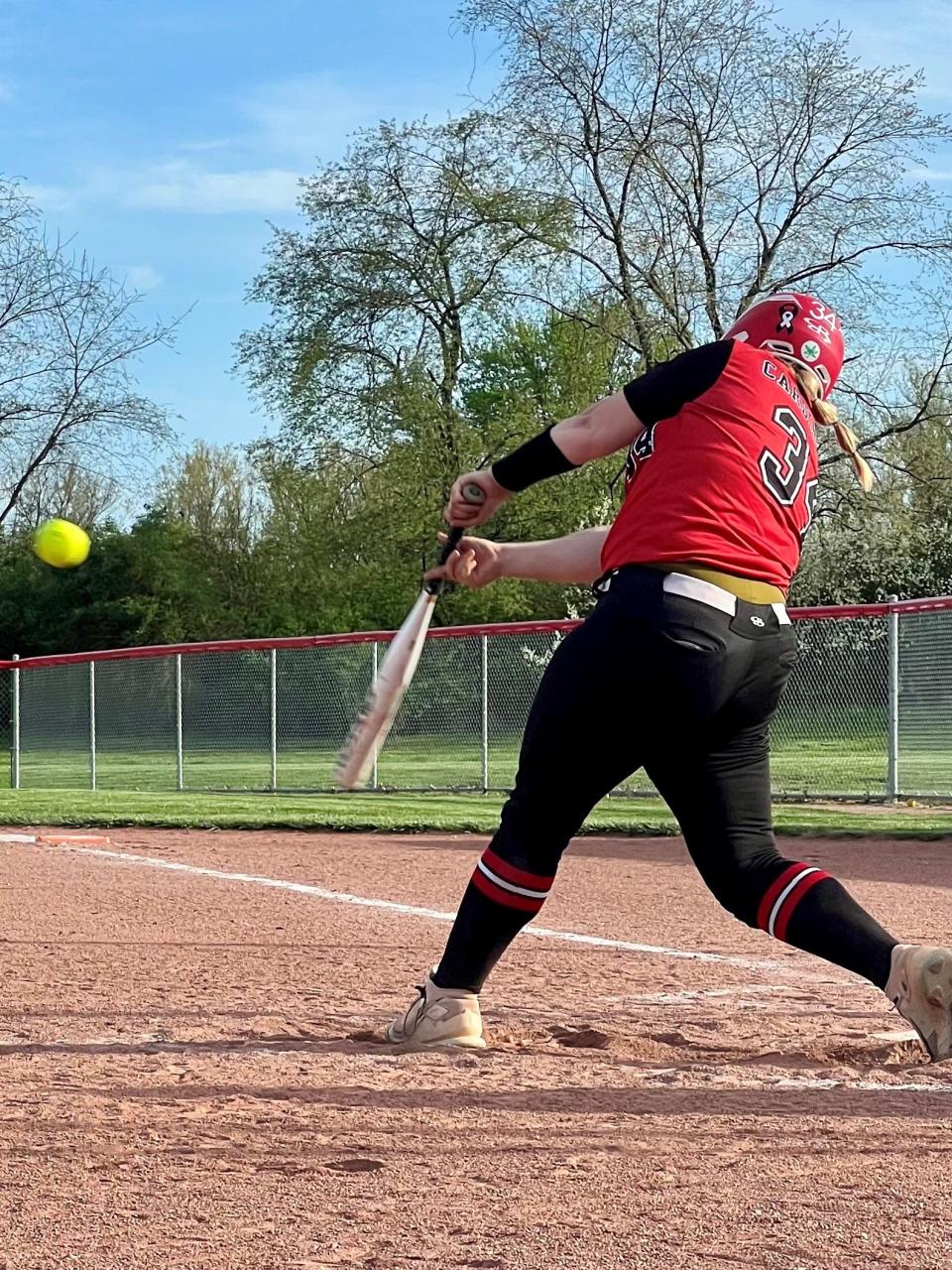 Cardington's Ari Simpson records a hit during Thursday's Knox Morrow Athletic Conference softball victory at Centerburg.