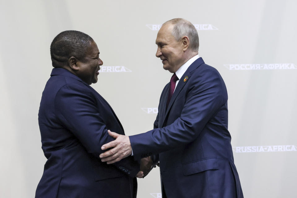 Russian President Vladimir Putin, right, and President of the Republic of Mozambique Filipe Jacinto Nyusi shake hands on the sideline of the Russia Africa Summit in St. Petersburg, Russia, Thursday, July 27, 2023. (Mikhail Metzel/TASS Host Photo Agency Pool Photo via AP)