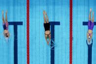 <p>South African athlete Schoenmaker swims next to Team USA's Annie Lazor and the ROC's Evgeniia Chikunova during the women's 200m breaststroke semifinal.</p>