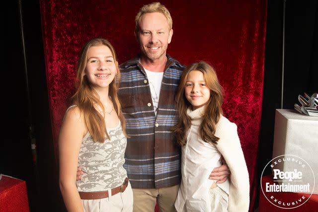 <p>Ben Trivett/Shutterstock</p> Ian Ziering and his daughters at Jingle Ball LA 2023