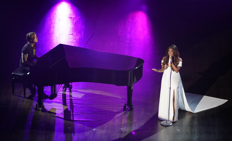 Mickey Guyton, right, and Keith Urban perform "What Are You Gonna Tell Her?" during the 55th annual Academy of Country Music Awards at the Grand Ole Opry House on Wednesday, Sept. 16, 2020, in Nashville, Tenn. (AP Photo/Mark Humphrey)