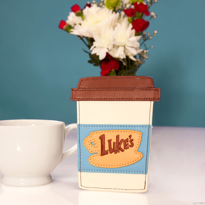 <p><a href="https://go.redirectingat.com?id=74968X1596630&url=https%3A%2F%2Floungefly.com%2Fgilmore-girls-lukes-diner-to-go-coffee-cup-card-holder%2FGLGWA0004.html&sref=https%3A%2F%2Fwww.goodhousekeeping.com%2Fholidays%2Fgift-ideas%2Fg60567835%2Fgilmore-girls-gift-ideas%2F" rel="nofollow noopener" target="_blank" data-ylk="slk:Shop Now;elm:context_link;itc:0;sec:content-canvas" class="link ">Shop Now</a></p><p>Luke's Diner To-Go Coffee Cup Card Holder</p><p>loungefly.com</p><p>$20.00</p>