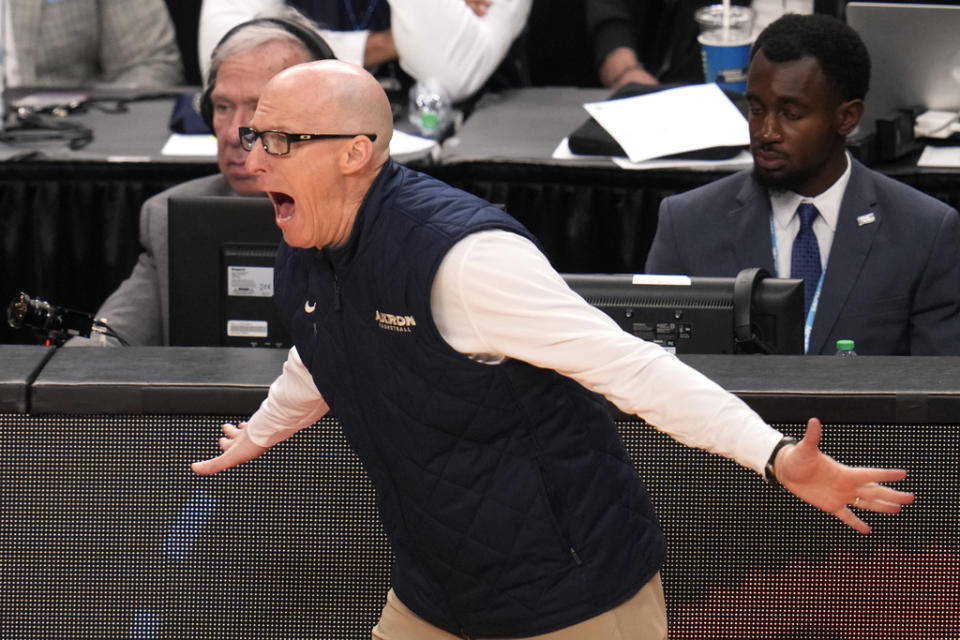 Akron head coach John Groce yells instructions during the second half of a college basketball game against the Creighton in the first round of the NCAA men’s tournament in Pittsburgh, Thursday, March 21, 2024. Creighton won 77-60. (AP Photo/Gene J. Puskar)