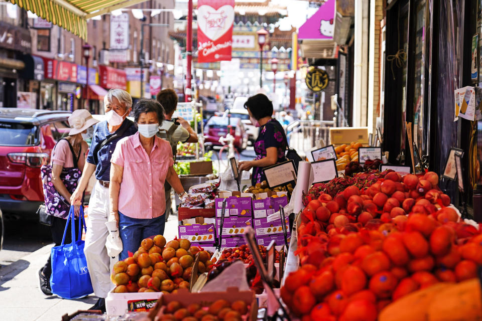 Customers shop for produce in the Chinatown neighborhood of Philadelphia (Matt Rourke / AP file)