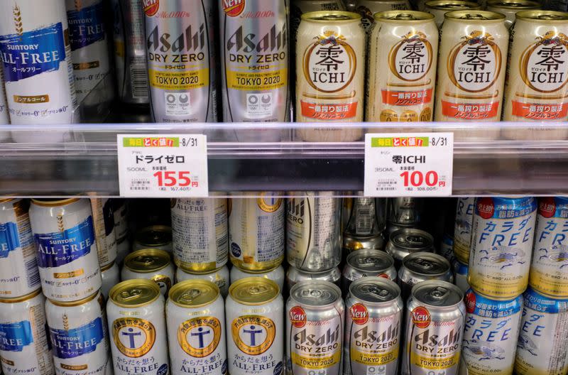 Various cans of alcohol-free beers are displayed on a supermarket shelf in Tokyo